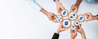 Zahnräder symbolisieren Kooperation