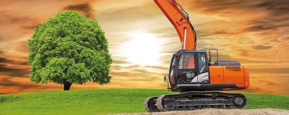 Bagger auf der Baustelle im Tiefbau -symbolisch für Bodenverbrauch