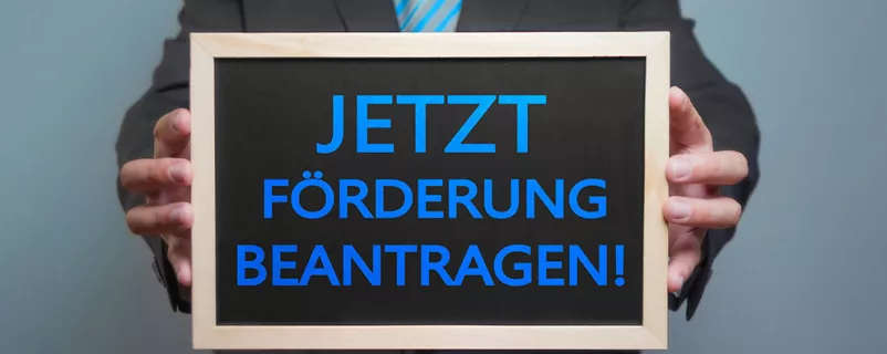 Schild "Jetzt Förderung beantragen"