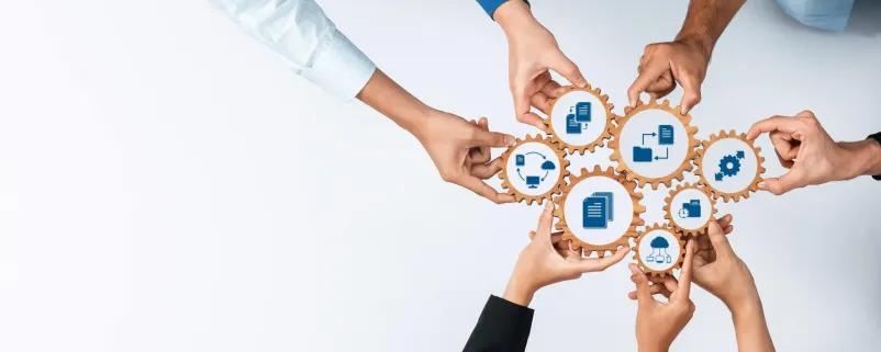 Zahnräder symbolisieren Kooperation