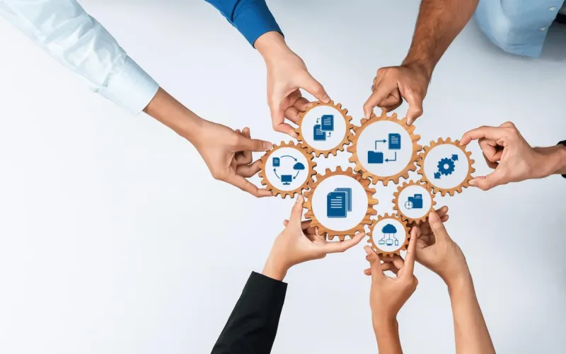 Zahnräder symbolisieren Kooperation